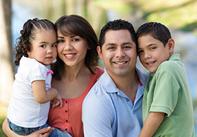 Photo of a happy family. Link to Life Stage Gift Planner Under Age 45 Situations.