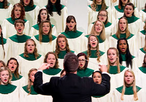 Choir singing. Links to Closely Held Business Stock